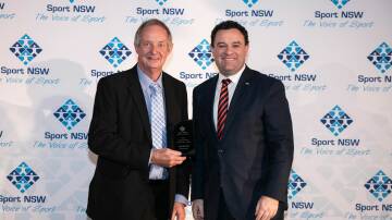  Les Taylor poses with Minister Ayres and his Distinguished Long Service Award. Photo: Supplied
