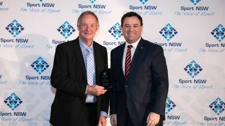  Les Taylor poses with Minister Ayres and his Distinguished Long Service Award. Photo: Supplied