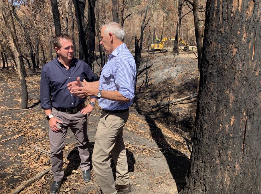 CLEAN UP: Bathurst MP Paul Toole with NSW Disaster Recovery co-ordinator Euan Ferguson discussing the continuing bushfire clean up. Picture: SUPPLIED.
