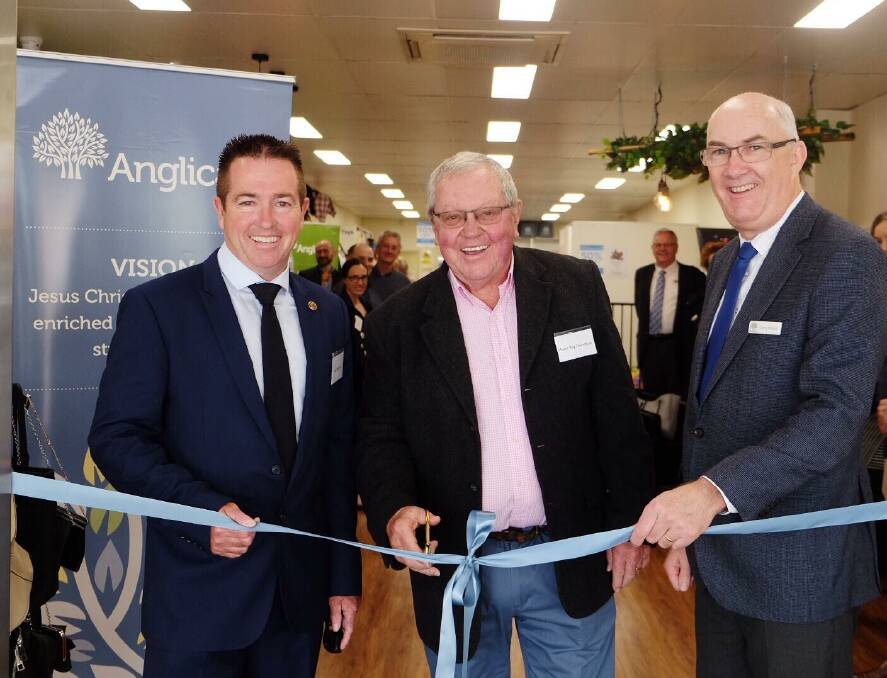 CUTTING THE RIBBON: Lithgow's first Anglicare shop officially opened by MP Paul Toole, Mayor Ray Thompson and CEO of Anglican community services Grant Millard. Photo: SUPPLIED.