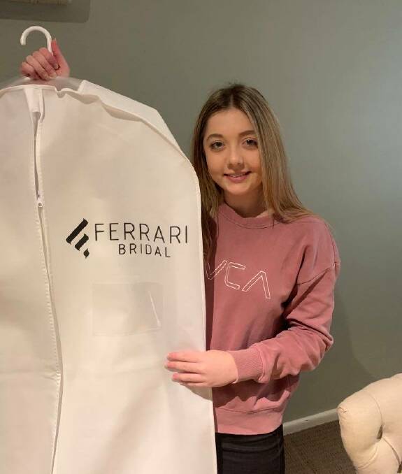 DEBUTANTE: Sixteen year-old Halle Roberts holds up her dress which she can't wait to show off in November. Picture: SUPPLIED.