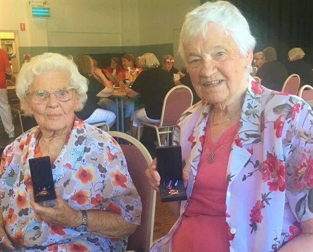 REMARKABLE: Peggy Russell and Rosemary Stanley with their husband's Arctic Star Medals. Photo: SUPPLIED.