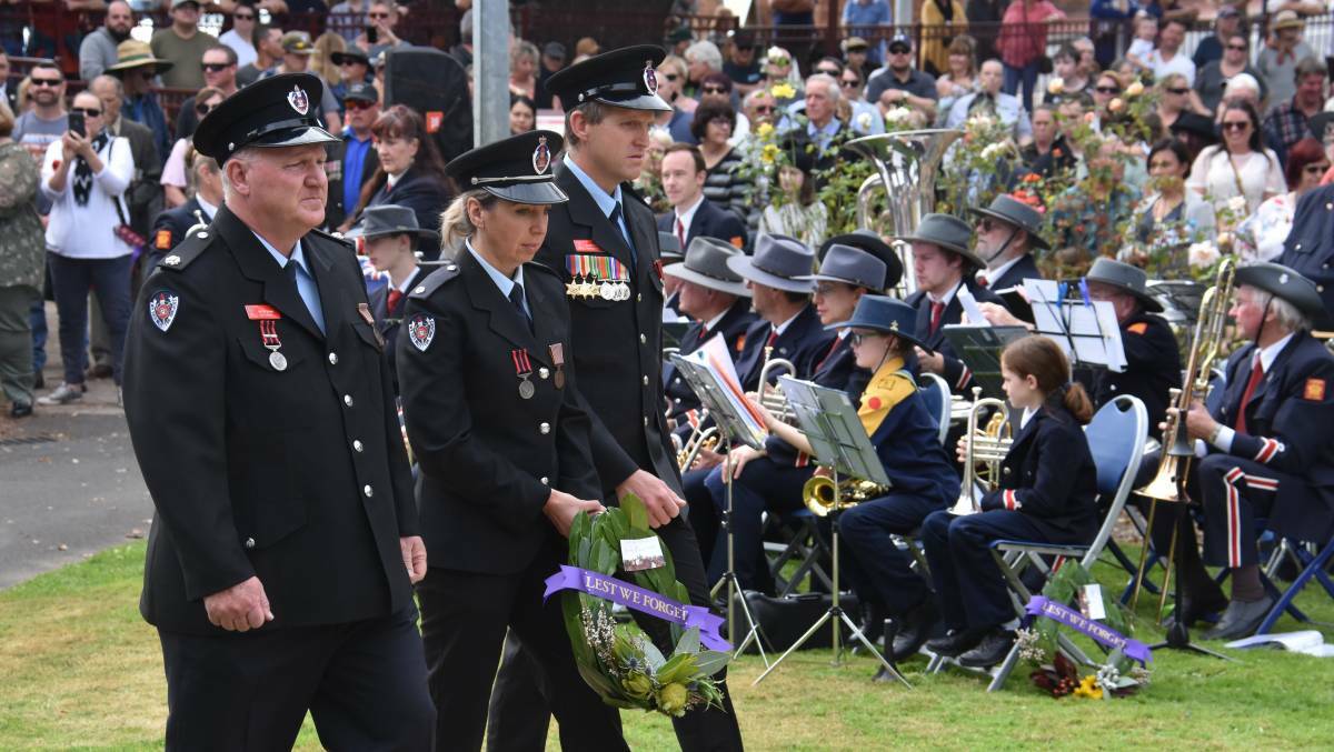 LARGE GATHERING: Members of the Lithgow NSW Fire and Rescue team lay a wreath at the 2019 Anzac Day service. Picture: ALANNA TOMAZIN
