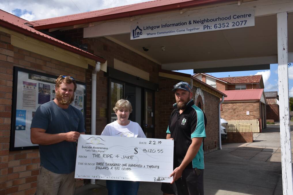 HANDOVER OF FUNDS: Jake's brother Benjamin Hatton, Leanne Walding and Chris Bennett at the Lithgow Information and Neighbourhood Centre. Picture: ALANNA TOMAZIN.