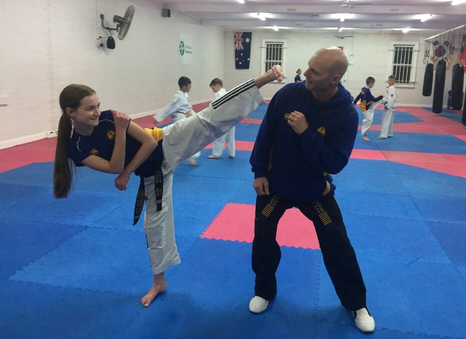 Alexis Reid shows off a fighting move with coach Jeff Crane at Haktari Martial Arts Centre. Photo: Reidun Bernsten