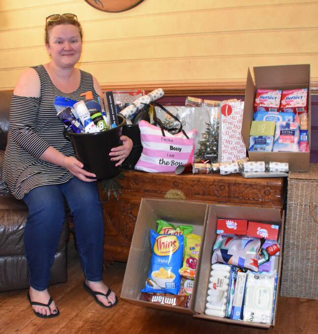 FARMERS CHRISTMAS DRIVE: Organiser Hayley Quinlan with some of the items that will be given to drought-stricken farmers this Christmas. Picture: ALANNA TOMAZIN.