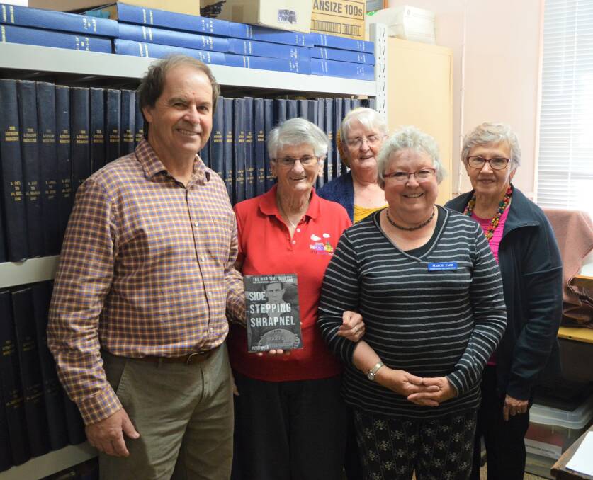 HELPING OUT: Peter Baker received help from Lithgow and District Family History Society members Rae Casey, Elanor Martin, Marcia Farr and Jan Saundercock.