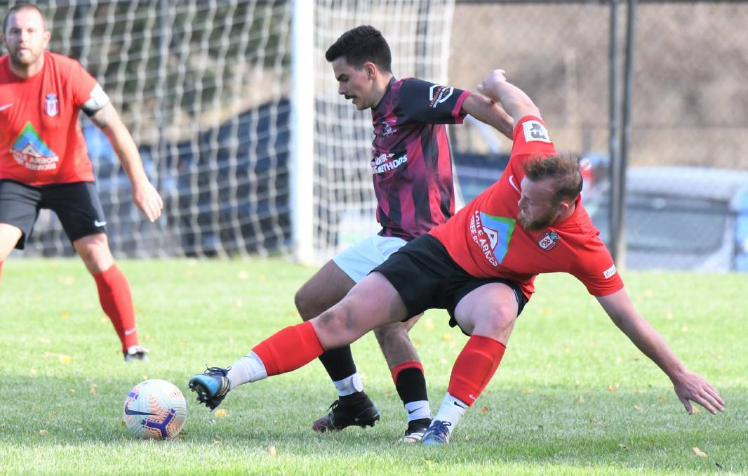 ACTION: Lithgow Workmen's Branko Bojanic goes in for the tackle on Panorama's Ryan Peacock earlier this season. Photo: CHRIS SEABROOK
