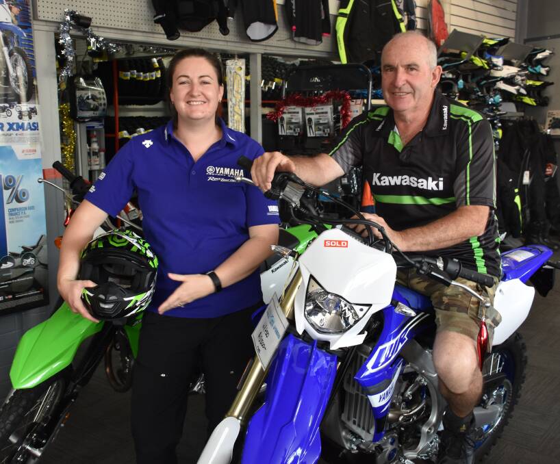 NEW OWNERS: Lithgow Bike Stop owner Katrina Knight with her dad and store director John Watkins. Picture: ALANNA TOMAZIN.