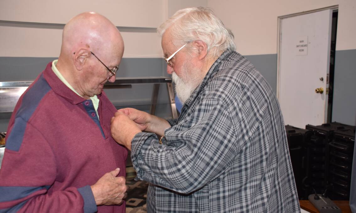 LIFE MEMBER: The moment Sandy Davidson receives his badge from president Danny Whitty as a token of life membership. Picture: ALANNA TOMAZIN.