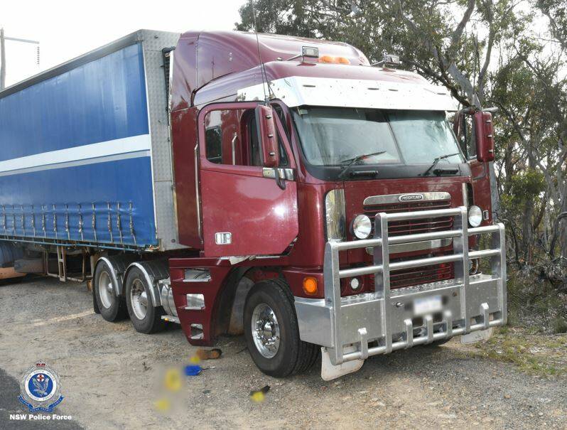 AMBUSH: A group of unknown men forced entry to the cabin of the truck: Photo: NSW POLICE FORCE Facebook page.
