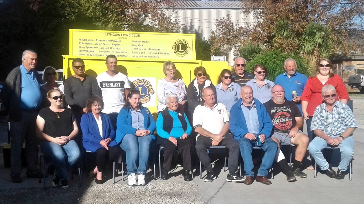 NEW UNIT: Lithgow Lions Club members and sponsors with the new yellow trailer. Picture: SUPPLIED.