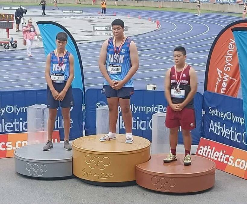 HONOURS: Gold medal winner Emeric Tauolo Fuamatu (middle) on the podium for the Australian junior title honours in the under 15 Shot Put. Picture: SUPPLIED