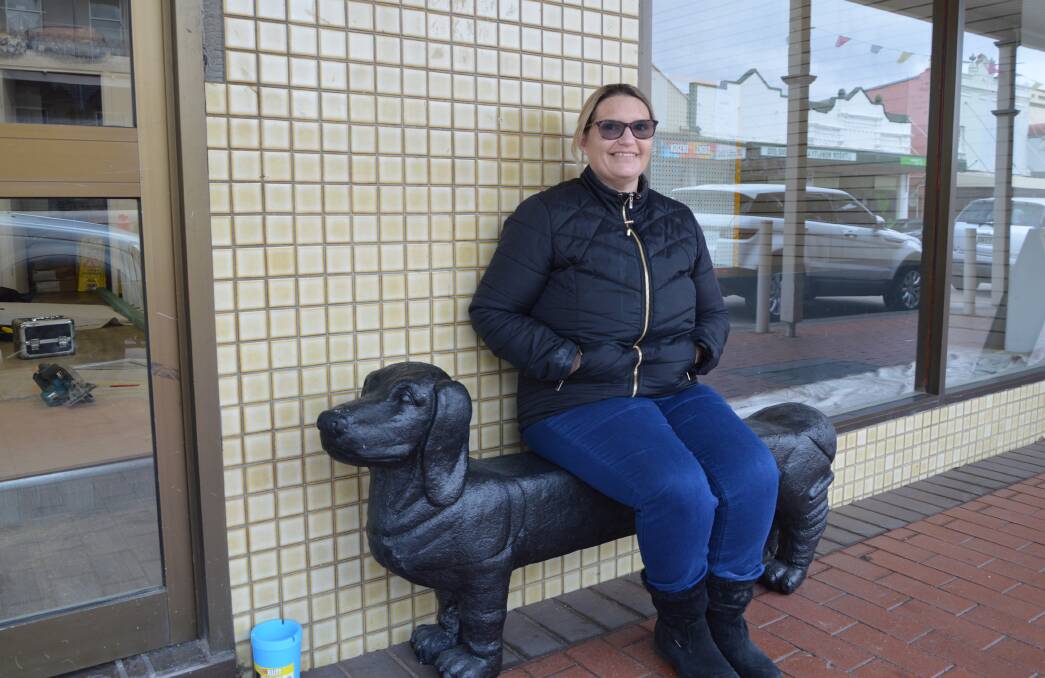 OPEN FOR BUSINESS: Silverdale Pet Supplies general manager Angela Grieg with a welcoming sausage dog statue at the new business on Main Street. Photo: ALANNA TOMAZIN