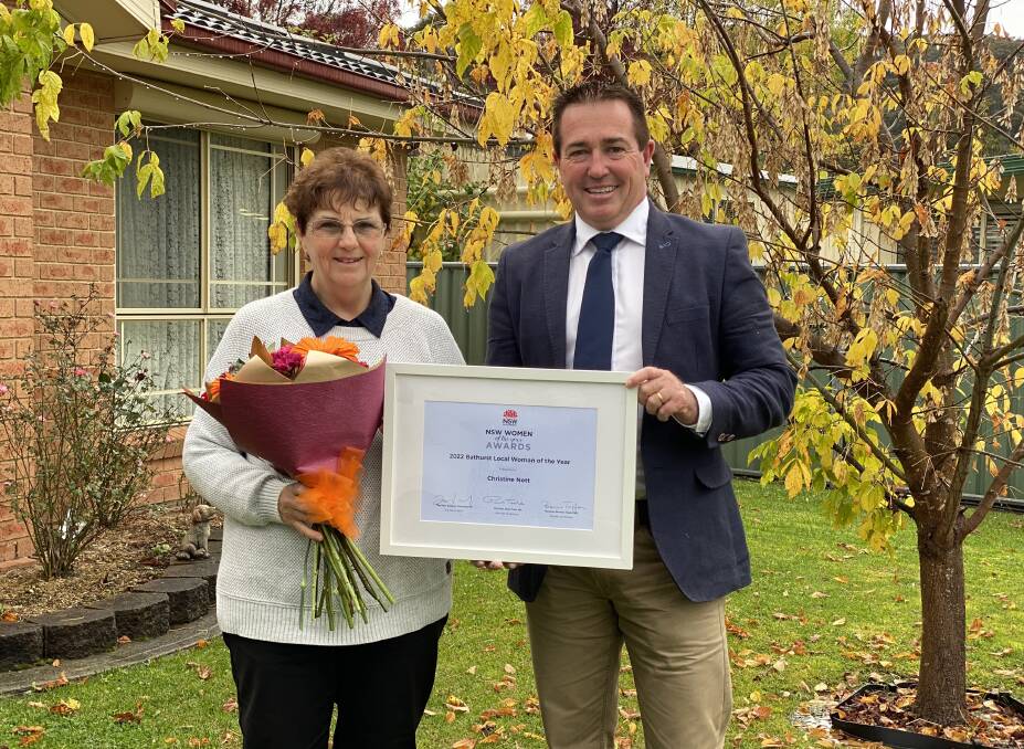 Lithgow's Christine Nott is presented with her accolade from Bathurst MP and NSW deputy premier Paul Toole. Picture: Supplied