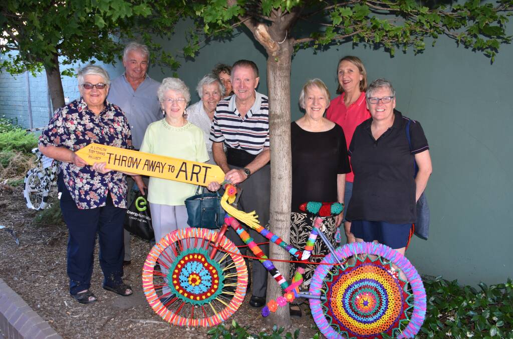 SPOKE-TACULAR: The Lithgow Tidy Towns group with local artists install the bicycles in Gallery Lane. Picture: ALANNA TOMAZIN.