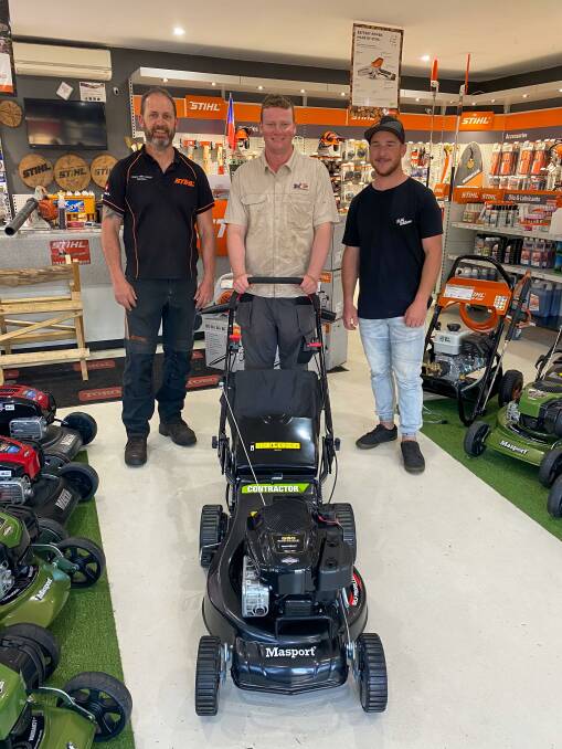 NEW MOWER: Lithgow Valley Outdoor Specialists owner Mick Wagner, Della's Gardening Services Joel Dellabosca and fundraiser organiser Mitch Hibbard with the brand new mower. Photo: SUPPLIED.