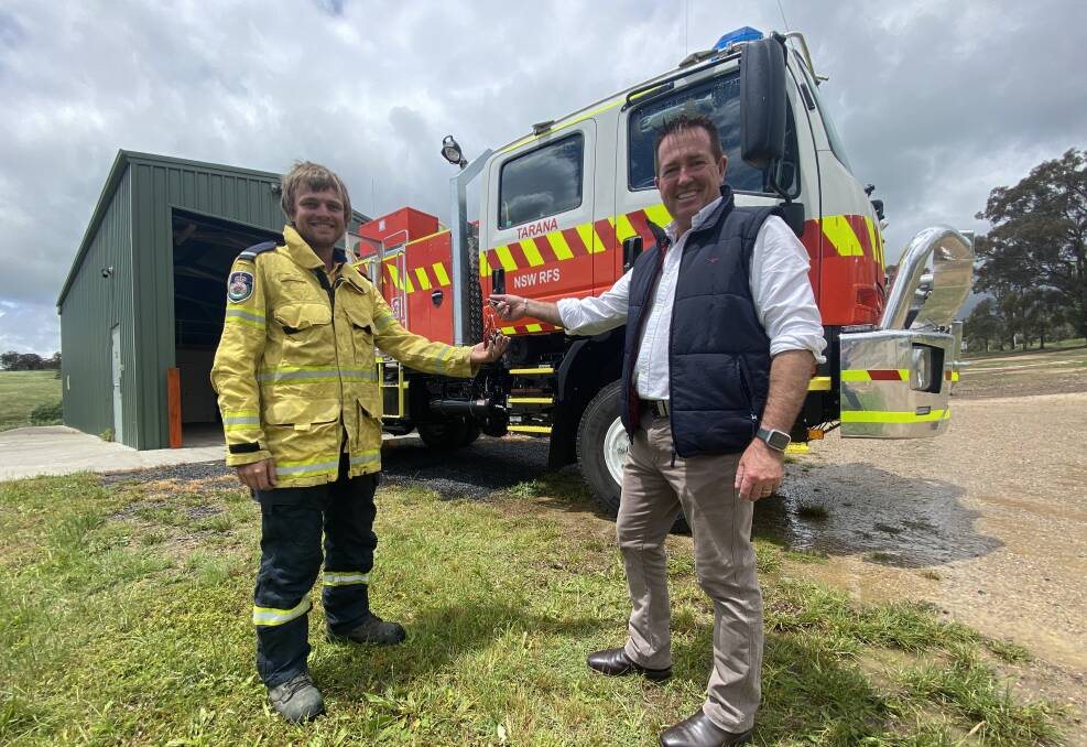 NEW TANKER: Member for Bathurst Paul Toole hands over the keys to the new Category One fire tanker to Tarana Rural Fire Service deputy captain Adrian Perry. Photo: SUPPLIED. 