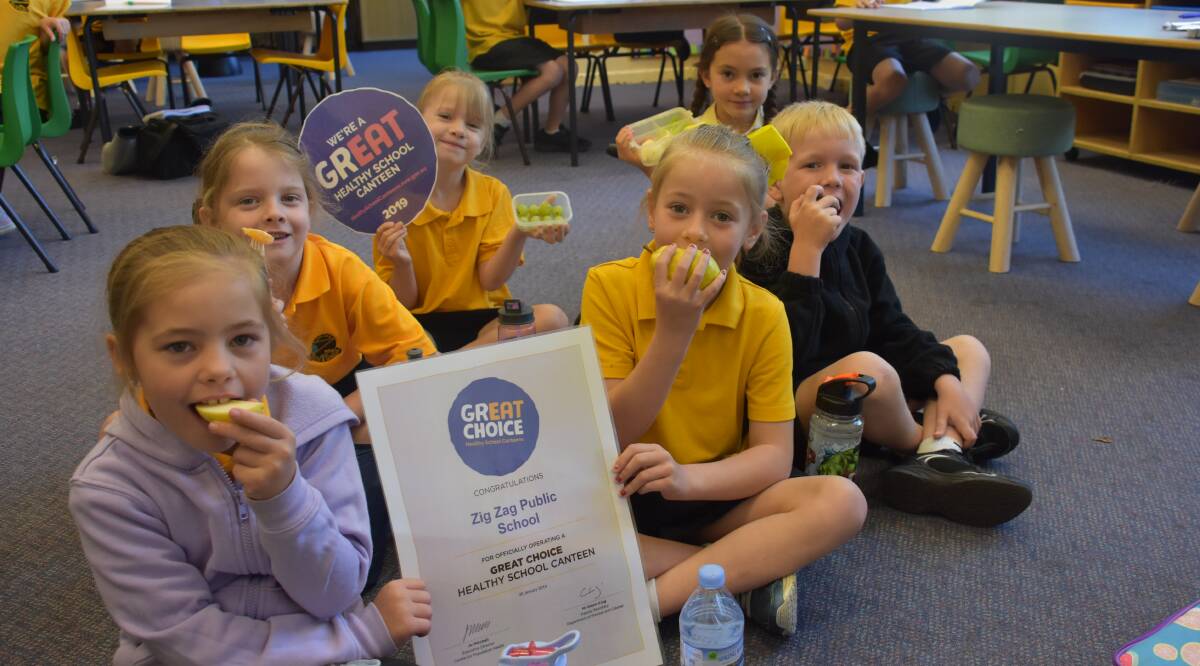 HEALTHY KIDS: Zig Zag Public's Caytlen Stacey, Jessica Harding, Claire Eagles, Cailey Ivers, Angus Small and Summer Sirisisavath enjoying their fruit.