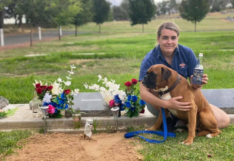 HEARTACHE: Maddie Bott visits Ethan's grave with dog Knox on what was meant to be their wedding day.