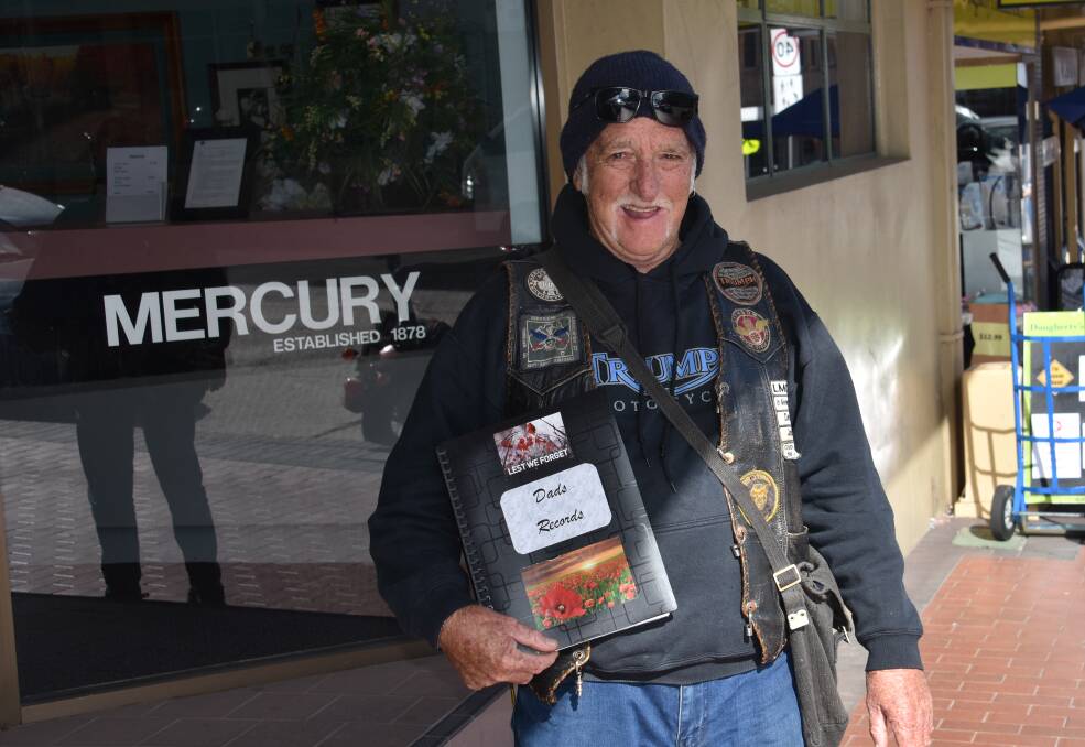 REMEMBERING TOM CAMBRIDGE: Bill Cambridge holding his Dad's records outside the Lithgow Mercury. Picture: ALANNA TOMAZIN