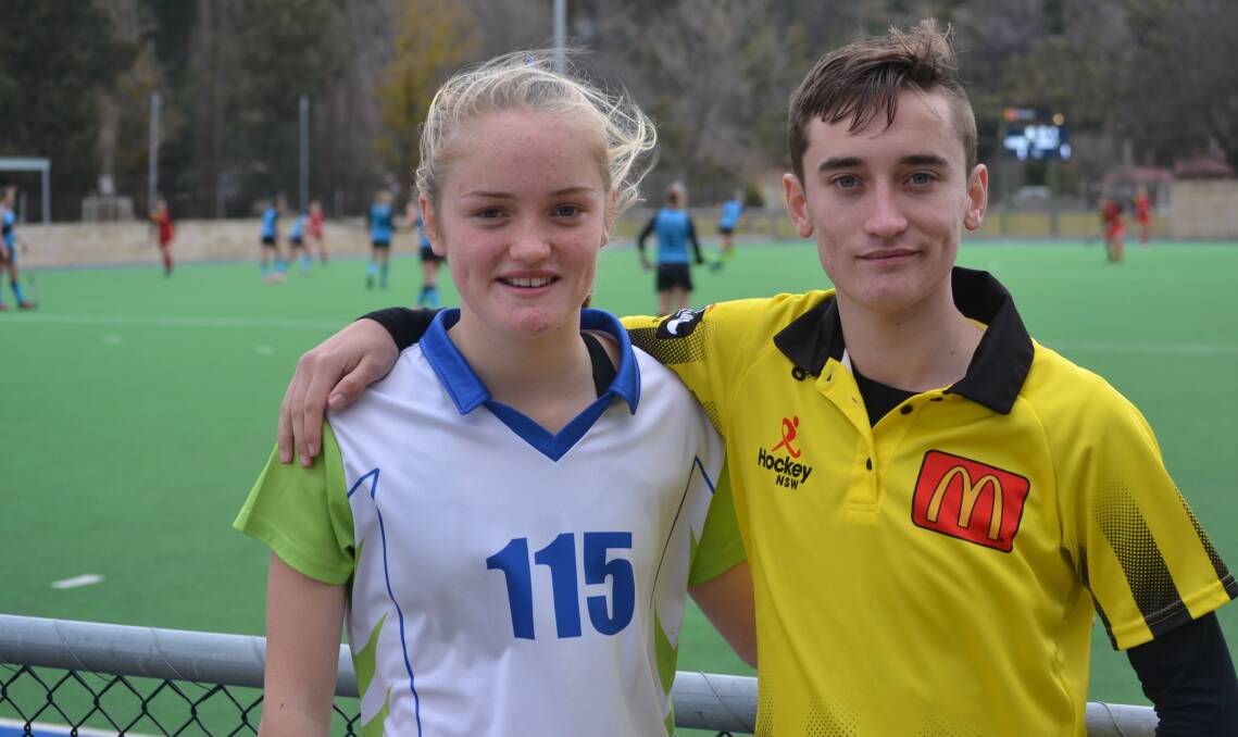 HOCKEY ACTION: Lithgow player Emily Dean and referee McLeod Dean. Photo: CIARA BASTOW