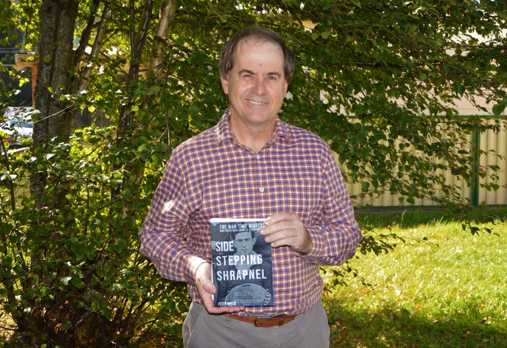 SIDE STEPPING SHRAPNEL: Writer Peter Baker with his newly self-published book. Photo: ALANNA TOMAZIN.