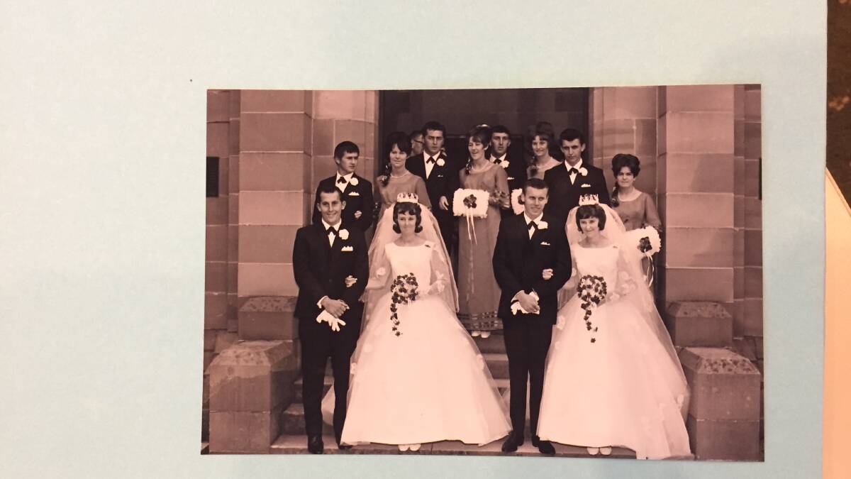 WEDDING PARTY: The double wedding party on the steps of Hoskins Church 50 years ago. Pictures: SUPPLIED.