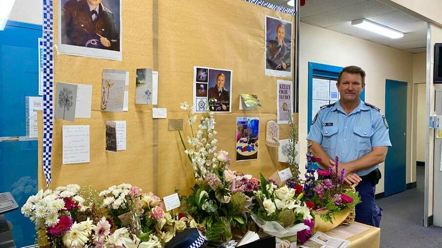 KELLY OUR HERO: Lithgow Police Sergeant Darryl Goodwin with the station's tribute for Sen Const Kelly Foster earlier this year. Photo: ALANNA TOMAZIN.
