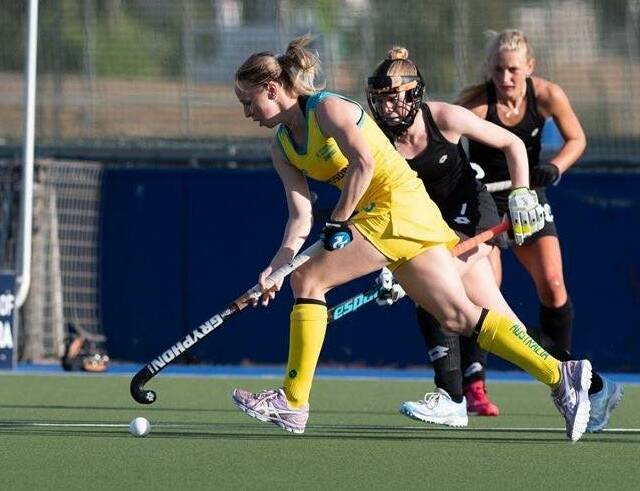 GREEN AND GOLD: Lithgow export Abigail Wilson in action on the hockey turf. Picture: Courtesy of Planet Hockey.
