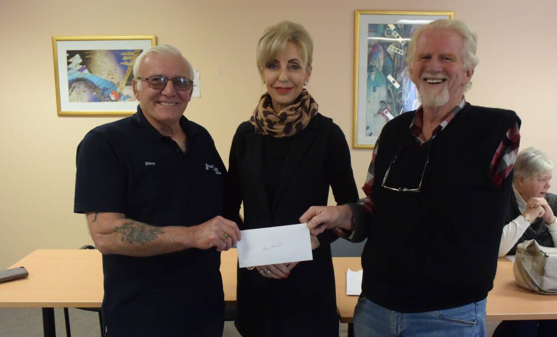 DONATION: Mountain Cruizers Car Club president Stephen O'Reilly, Lithgow Can Assist president and Lithgow City Councillor Maree Statham and Mountain Cruizers Car Club vice president David Wilpour. Picture: ALANNA TOMAZIN.