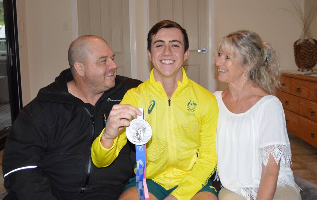 PROUD AS PUNCH: Richard and Tania with their Olympic silver medal winning son Lachi Sharp. Picture: ALANNA TOMAZIN