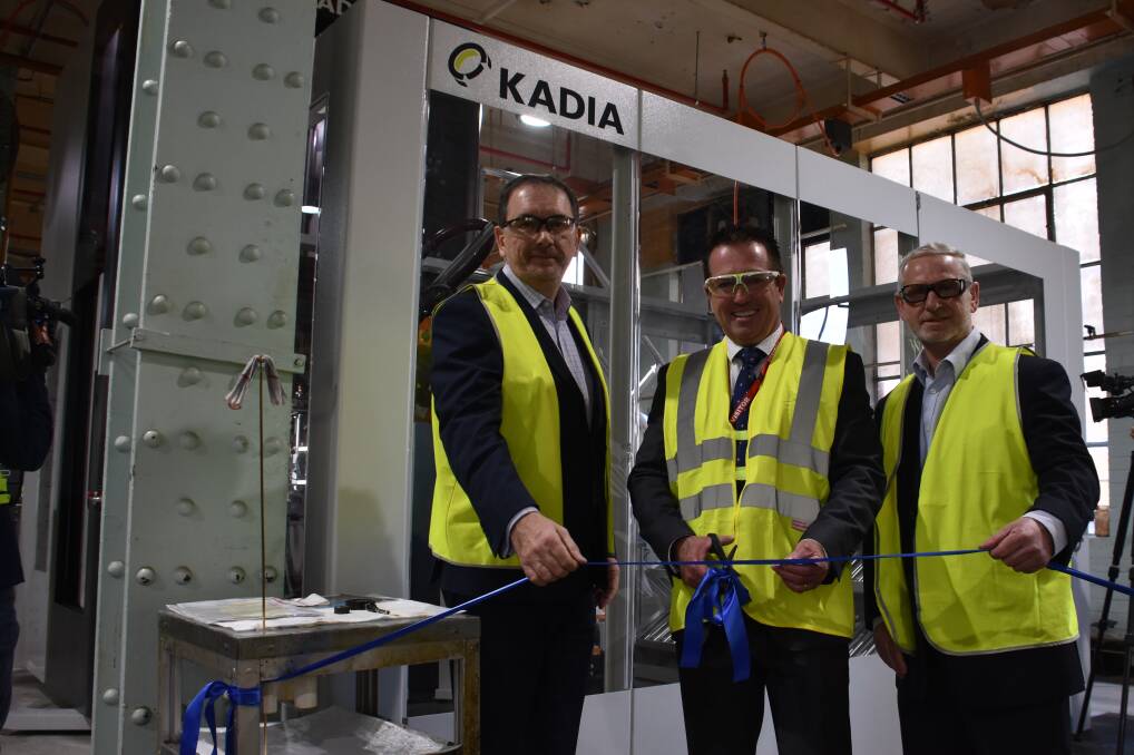 HONING MACHINE: Soldier Weapons Systems director Graham Evenden, Bathurst MP Paul Toole and Thales Group Continuous Improvement manager David Forbes cut the ribbon for the new $1.8 million investment. Picture: ALANNA TOMAZIN.
