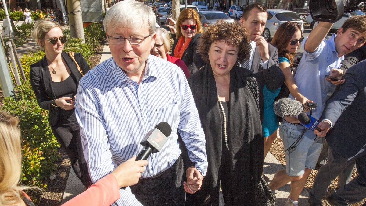 The press pack follows Prime Minister Kevin Rudd and his wife Therese Rein on the way to church in Brisbane on Sunday, August 4, 2013.