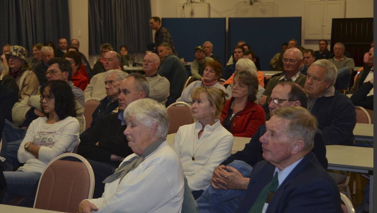 MEETING DRAWS A CROWD: Attentive listeners hear the call for people power
