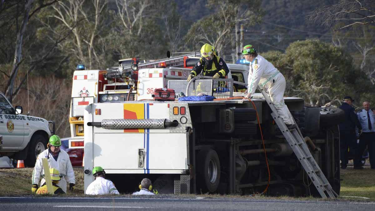 Emergency services scramble to free inmates after a prison van overturned near the Lithgow Correctional Centre in May. Photo: Troy Walsh