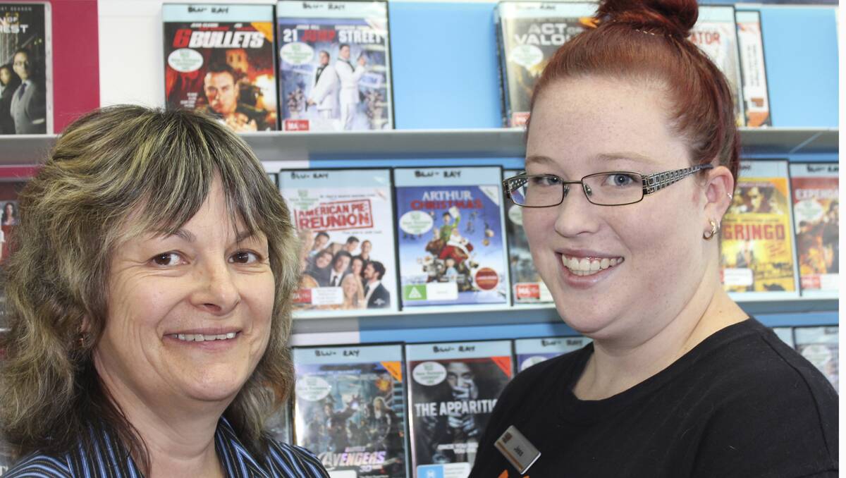 SAD TIMES FOR HOME MOVIE FANS:  Co-proprietor of Lithgow’s Video Ezy Irene Goulding with staff member Jess Laird. 	lm021213videoezy
