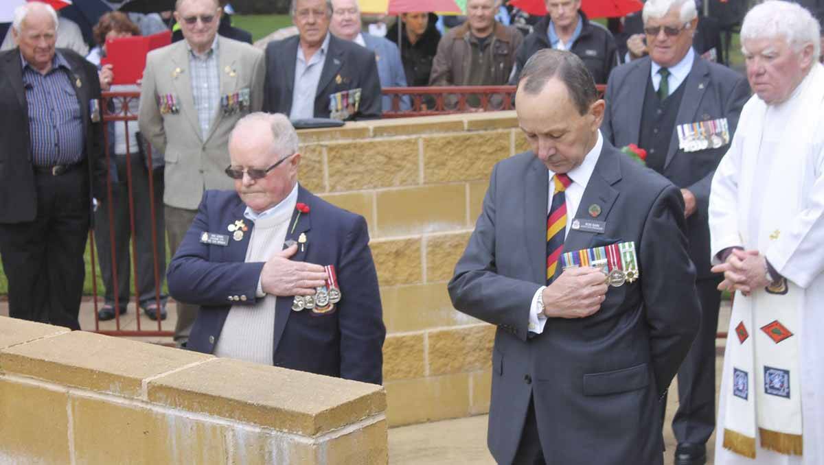 Lithgow RSL sub branch’s Max Hemmy, and NSW RSL State Councillor Dr Rod Bain pay their respects at the unveiling of the Vietnam Veterans plaque in November. Photo: Laura Pillans