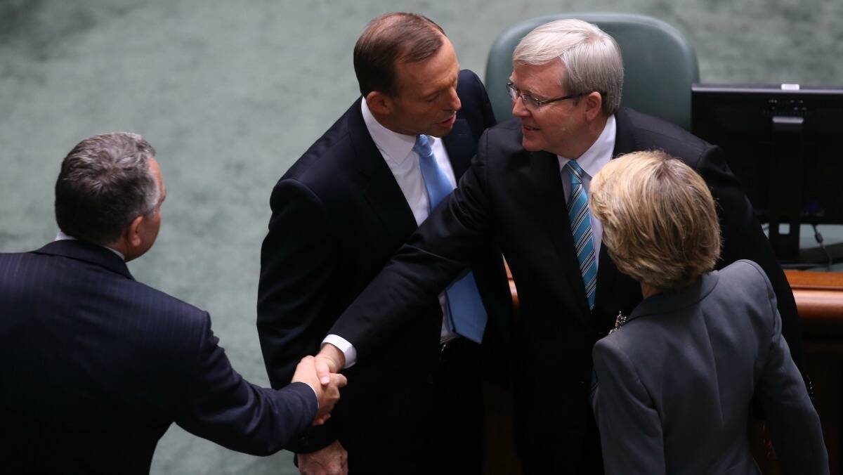 Prime Minister Kevin Rudd is congratulated by Opposition Leader Tony Abbott while greeting Shadow Treasurer Joe Hockey after he returned to the House of Representatives at Parliament House in Canberra on Thursday June 27.  Photo: Andrew Meares.