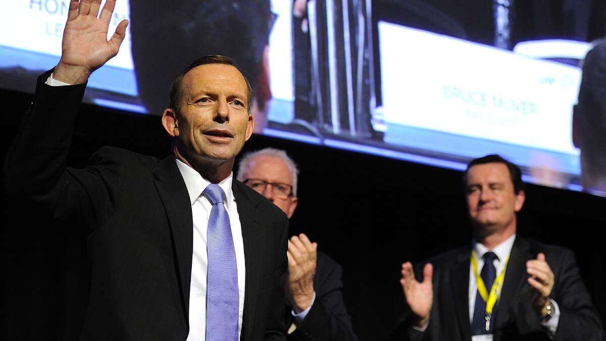 Opposition Leader Tony Abbott acknowledges delegates during an LNP State Convention at the Royal International Centre on July 20. Photo by Matt Roberts/Getty Images.