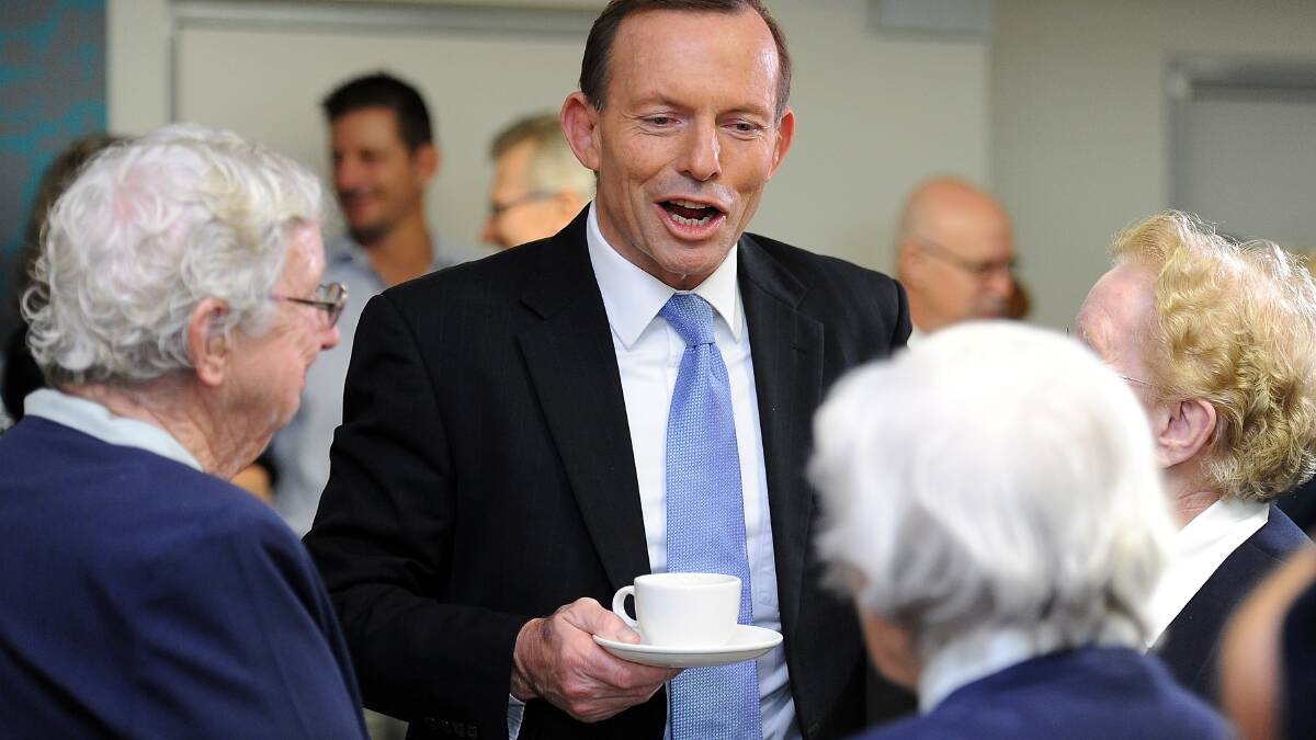 Opposition Leader Tony Abbott speaks with guests prior to a news conference at St Vincent's Private Hospital on July 20, 2013 in Brisbane. hoto by Matt Roberts/Getty Images.
