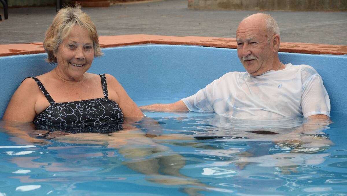 Trevor Muir andwife Jan cool off at the Murray Bridge Caravan Park's swimming pool.